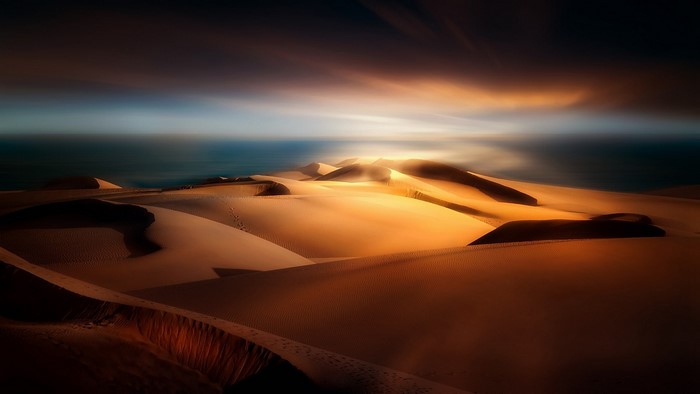 Desert dunes at sunset