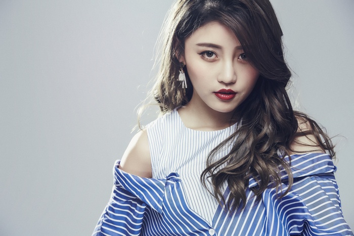 Asian model with wavy hair and red lipstick