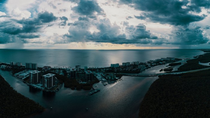 Cityscape with Ocean and Stormy Clouds
