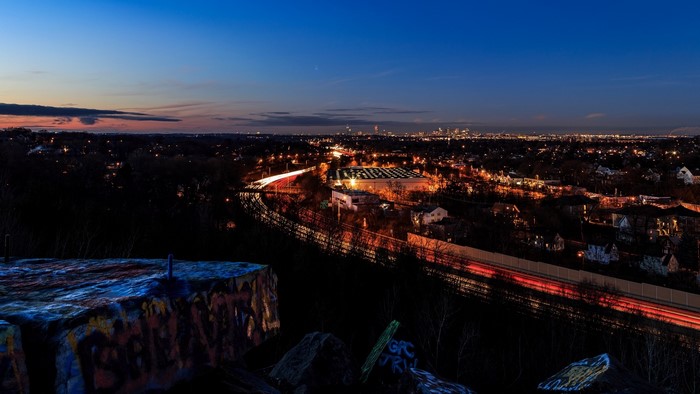 Cityscape at Dusk with Highway and Graffiti