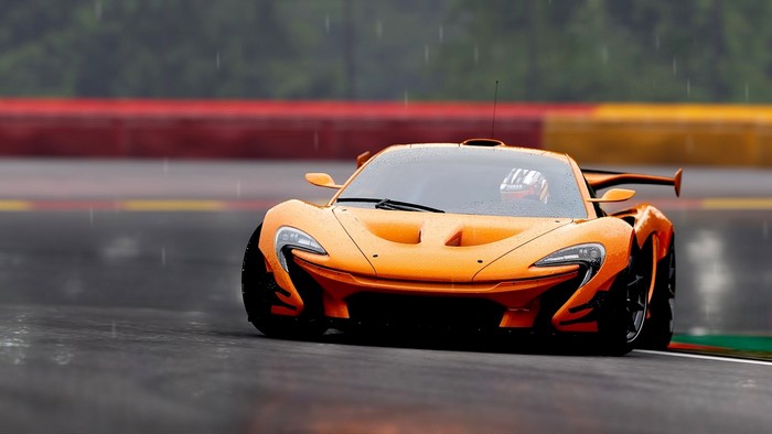 Orange McLaren P1 GTR on a wet race track