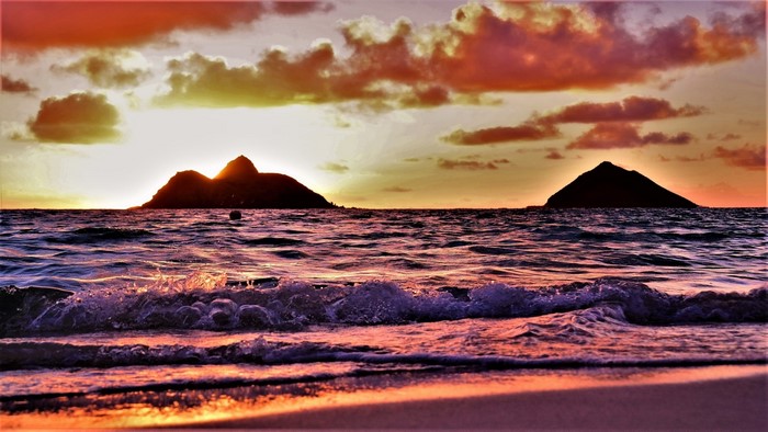 Sunset over the ocean with islands
