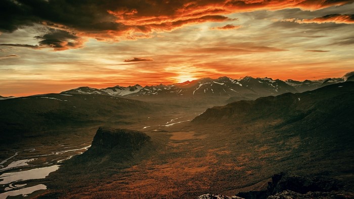 Sunset over a mountain valley with a river
