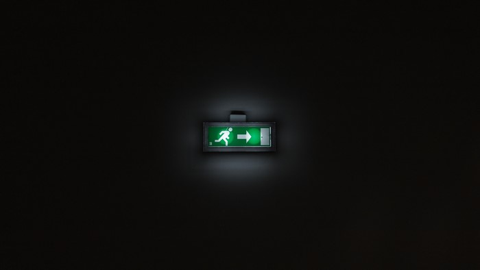 Green Exit Sign with Running Man Icon