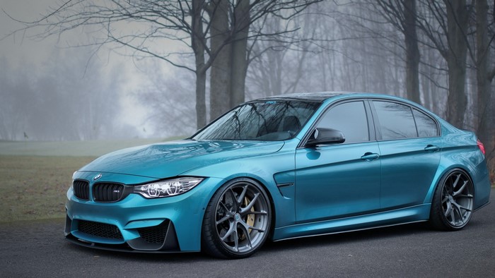 Blue BMW M3 Sedan on Road
