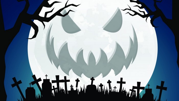 Halloween Jack-o'-lantern moon over a graveyard
