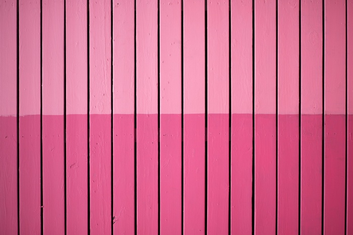 Pink wooden fence with shadows