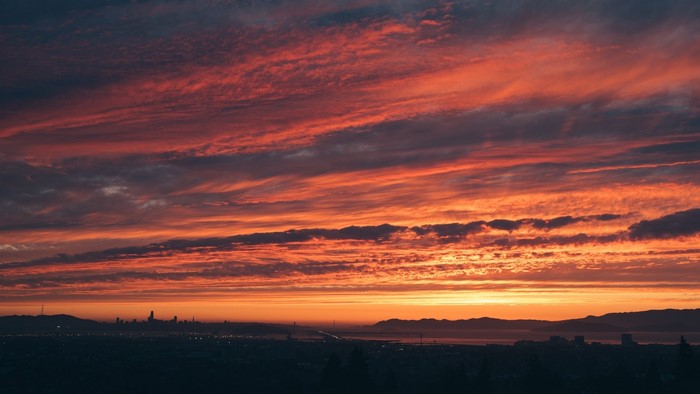 Sunset over a city skyline