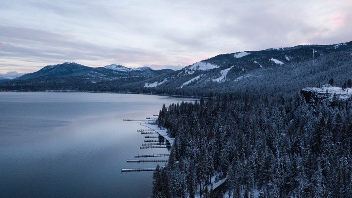 Snowy Mountains and Lake with Docks