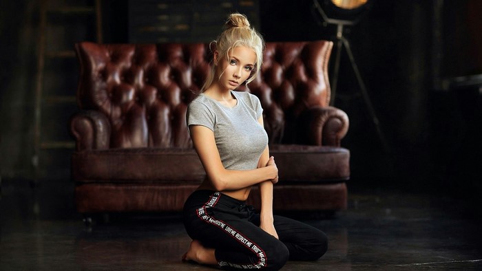 Woman in grey crop top and black pants