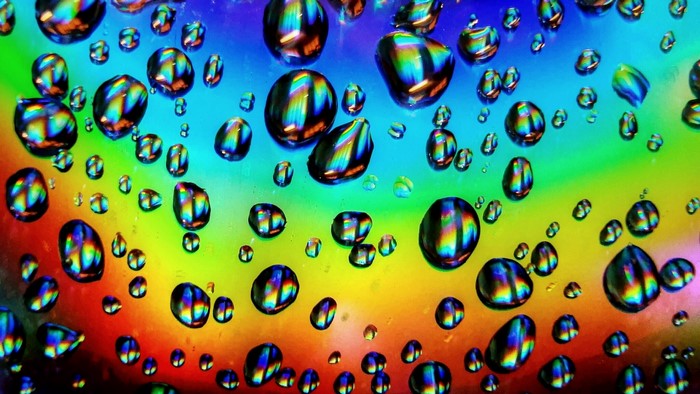 Water Drops on Rainbow Background