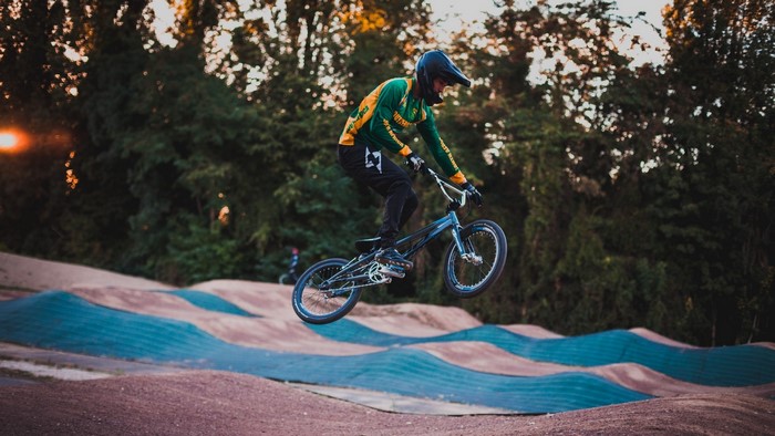 BMX cyclist jumping on a dirt track