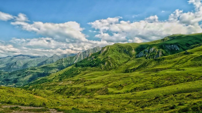 Green Mountains and Cloudy Sky in France