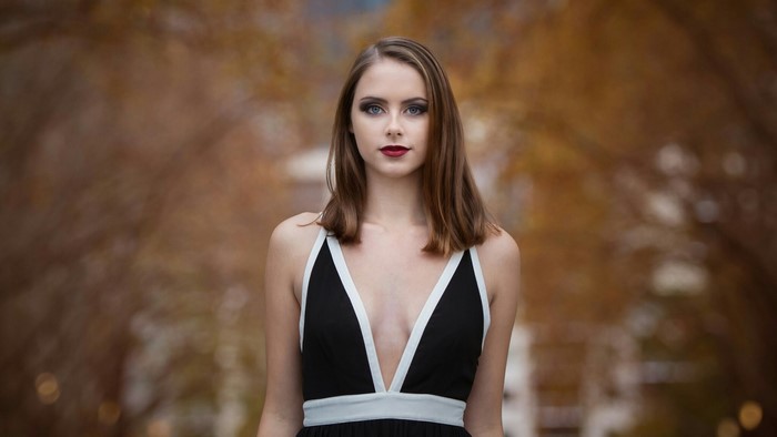 Woman in a black dress with white trim