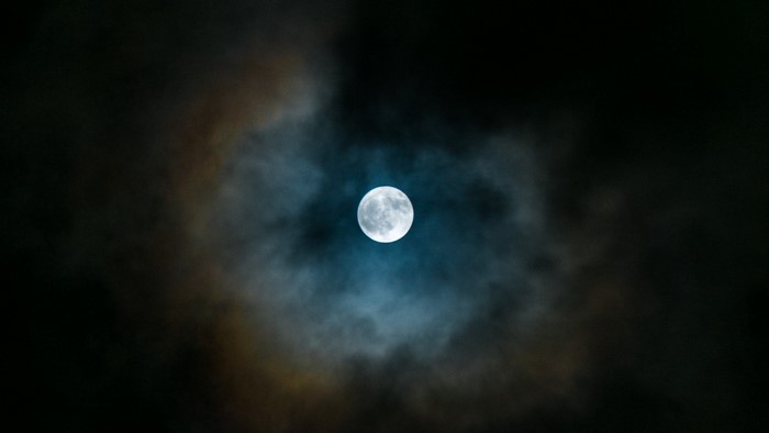 Full moon through clouds