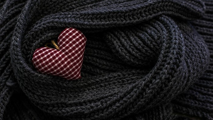 Heart-shaped ornament on a knitted scarf