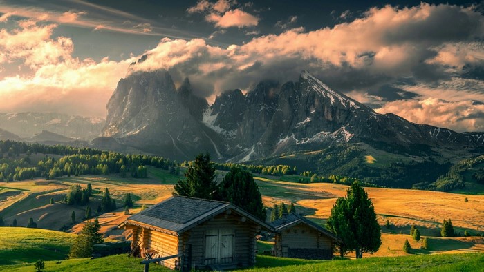 Small wooden houses in a mountain landscape