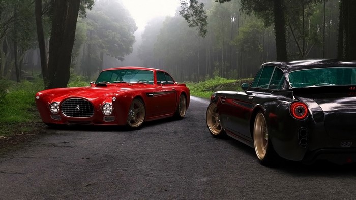 Red and black retro Ferrari cars on a forest road
