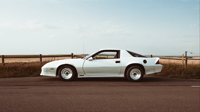 White Chevrolet Camaro parked on a road