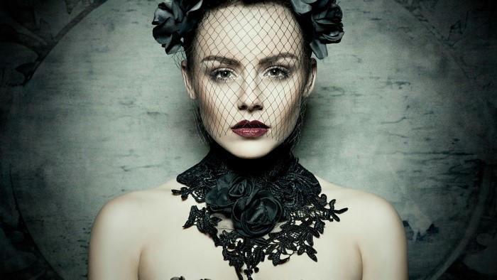 Woman with black veil and lace choker