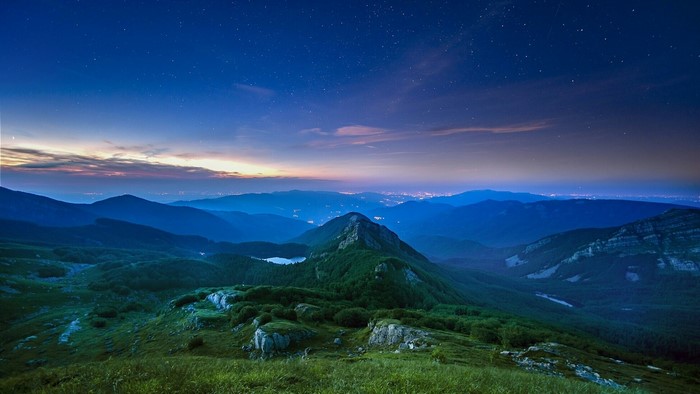 Mountains at twilight with stars