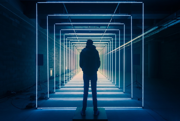 Person in LED light tunnel