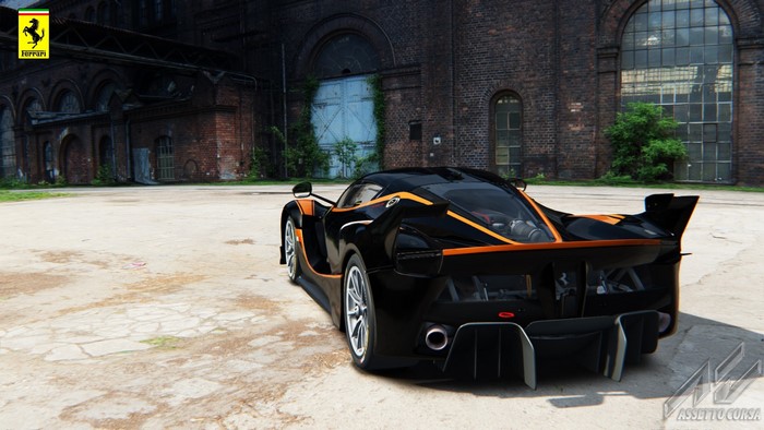 Ferrari FXX K in front of an old brick building