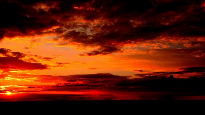Fiery Sunset with Dramatic Clouds