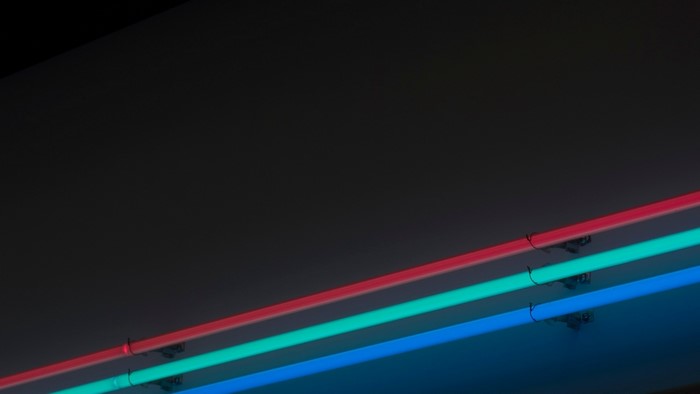 Three neon lights in red, green, and blue