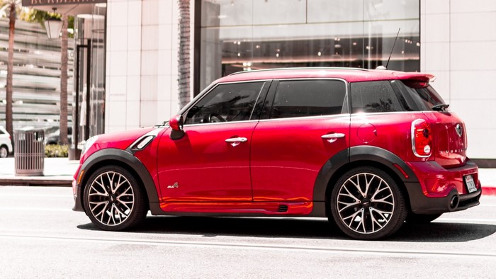 Red Mini Cooper Countryman parked on a street