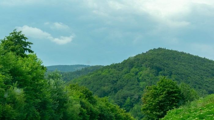 Green Hills and Cloudy Sky