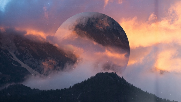 Geometric circle over misty mountains at sunset