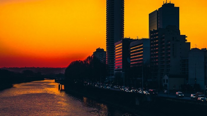 City skyline at sunset with river
