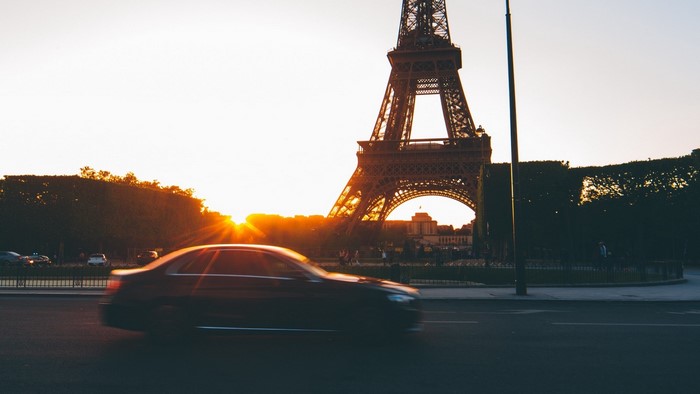 Eiffel Tower at sunset with car in Paris