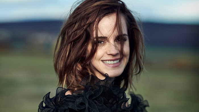 Emma Watson smiling outdoors