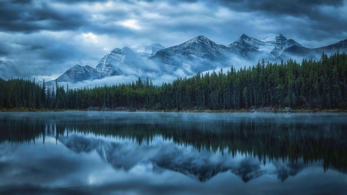 Misty Mountains Reflected in a Calm Lake