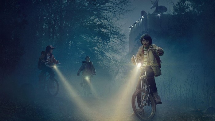 Stranger Things kids on bikes at night