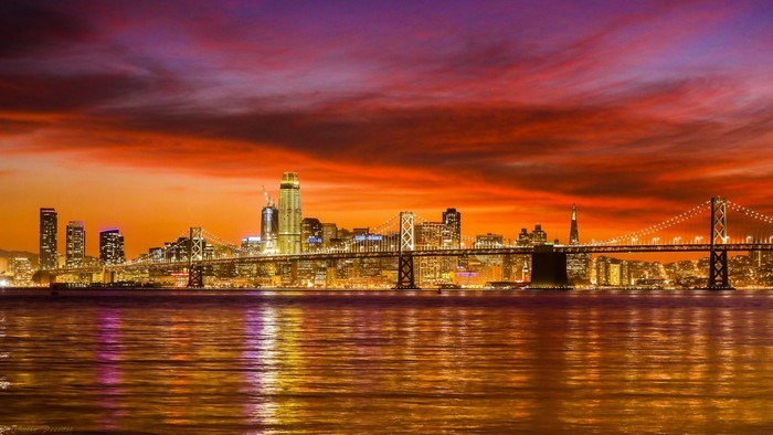 San Francisco Bay Bridge and skyline at sunset
