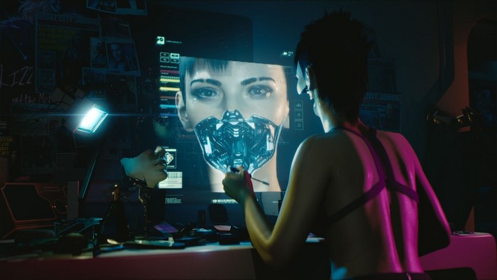 Woman modifying a cybernetic mask in Cyberpunk 2077