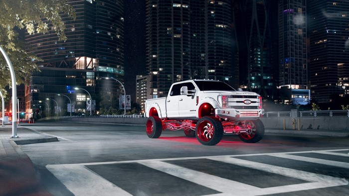 White Ford F-250 Super Duty truck with red accents