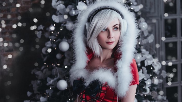 Woman in Santa Outfit with Headphones