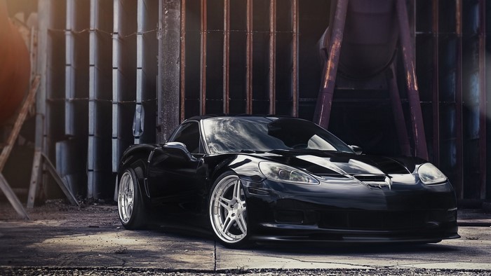 Black Chevrolet Corvette C6 on concrete