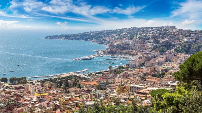 Naples, Italy coastline with harbor and cityscape