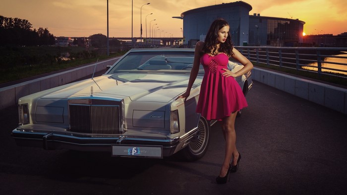 Girl in pink dress with Lincoln Continental