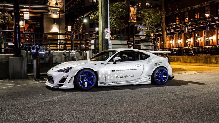 White Scion FR-S with custom body kit and blue wheels
