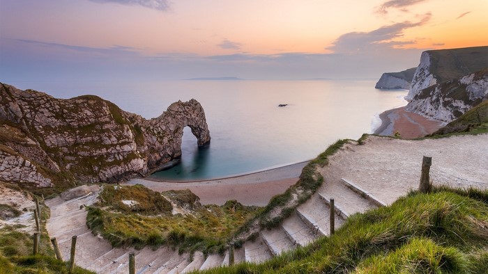 Durdle Door and Jurassic Coast, England at Sunset