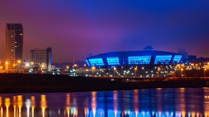 Donetsk stadium at night with river reflection