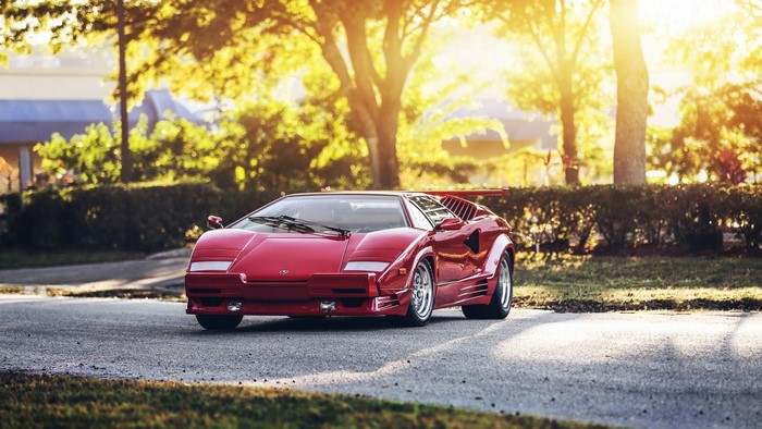 Red Lamborghini Countach parked on asphalt