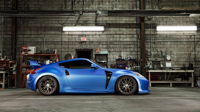 Blue Nissan 370Z in a garage