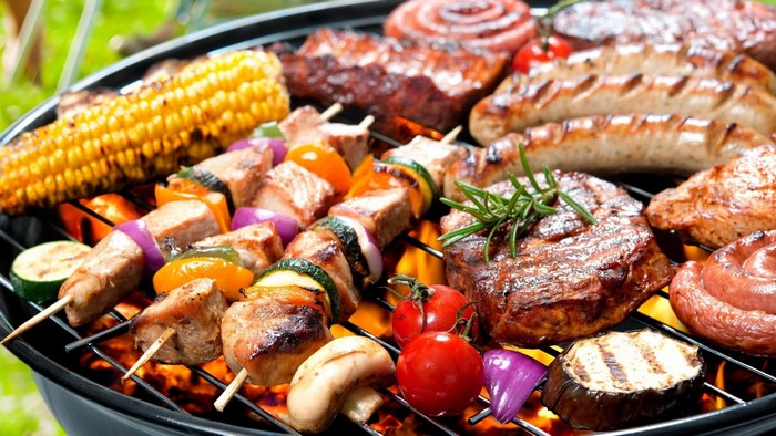 Barbecue grill with various meats and vegetables